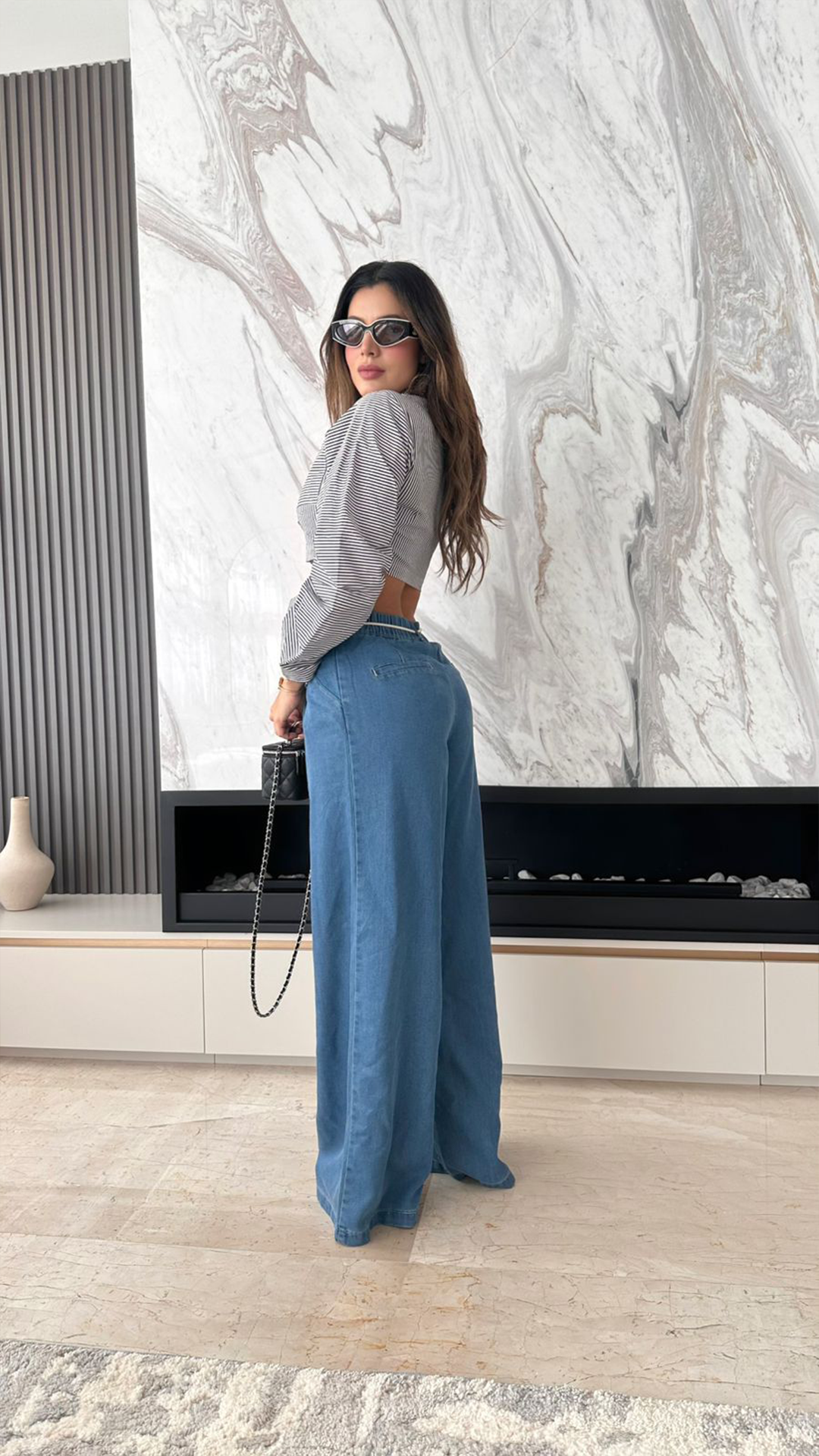 Jeans denim a la cintura y lazo